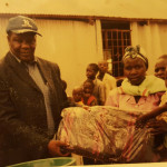 Bro. Makona donates blankets ,utensils and clothing to orphans and widows at Kiminini Market