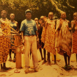 Bro. Makona shares gospel to young girls at water pump. They need living water -- Jesus Christ.