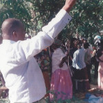 Bro Makona preaching in a crusade in the jungle