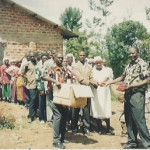 Bro Makona giving out Swahili Bibles