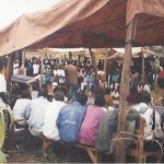 Bro Makona preaching in a rural village of Uganda
